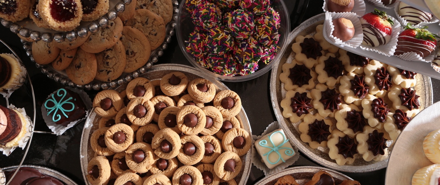 Nice wedding cookie table with an assortment of cookies.