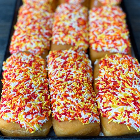 Unfilled Long JohnSeasonal Sprinkle Topped6 Pack - We Create Delicious  Memories - Oakmont Bakery