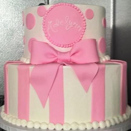 Pink tiered cake with big bow