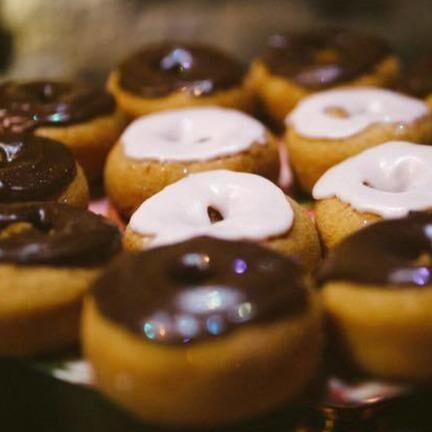 Glazed donuts arranged on a table